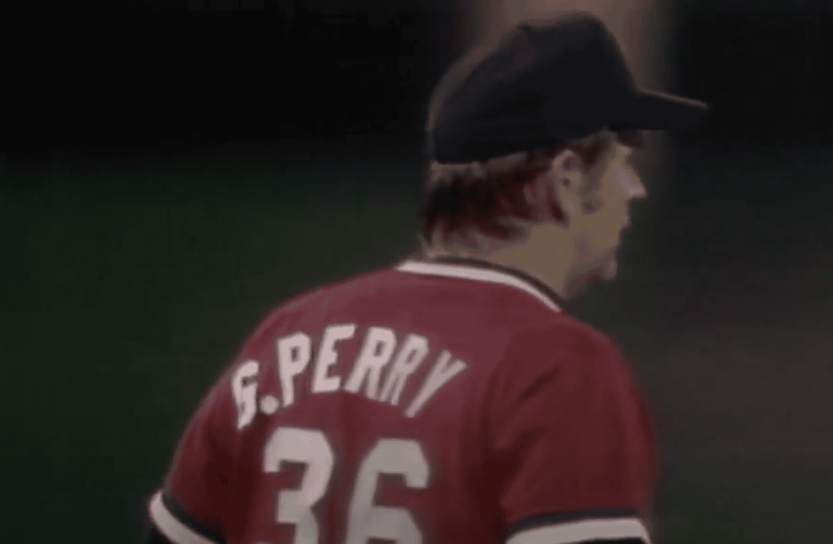 Image of Gaylord Perry showcasing his spitball technique during a game.